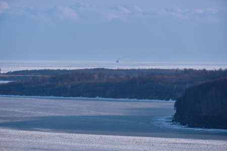Vanino, Russia - Jan 18, 2021: Vanino Bay in the Tatar Strait in winter. The frozen seaの写真素材