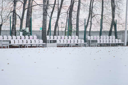 The first snow in Khabarovsk, Russia. Sports football field in the snow.の写真素材
