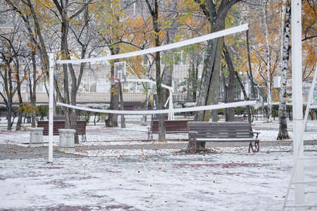 The first snow in Khabarovsk, Russia. Sports volleyball court in the snow.の写真素材