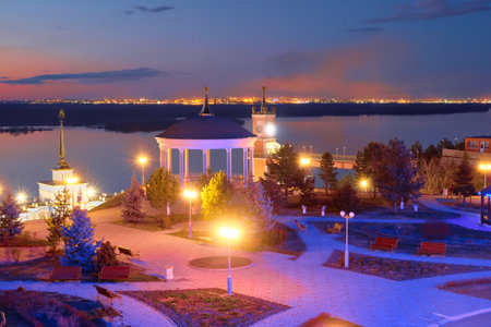 The territory of the tourist complex Zaimka against the background of a bright sunset over the Ussuri River near the city of Khabarovsk. Russia.の写真素材