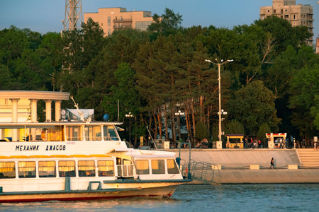 Khabarovsk, Russia - Jul 19, 2019: View of the city of Khabarovsk from the Amur river. Urban landscape in the evening at sunset.のeditorial素材