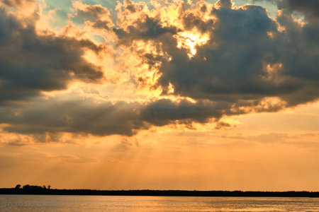 Sunset on the embankment of the Amur river in Khabarovsk. The sunset over the horizonの写真素材