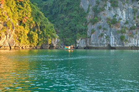 Vietnam, Halong Bay, UNESCO World Heritage Site, during sunset.の写真素材