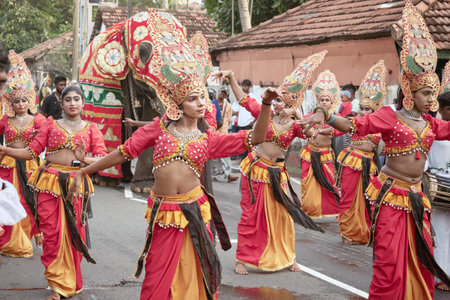 Hikkaduwa, Sri Lanka - Dec 28, 2025: A procession of Sri Lankan people in national costumes during...