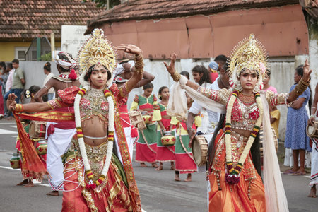 Hikkaduwa, Sri Lanka - Dec 28, 2025: A procession of Sri Lankan people in national costumes during...