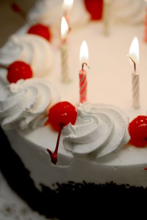 Birthday cake with lit candles