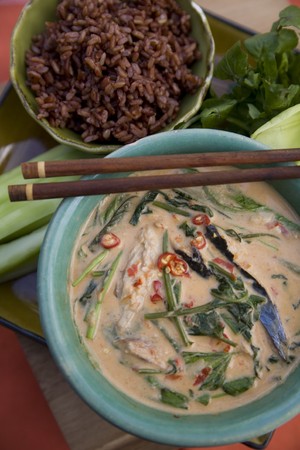 Thai food delicacies presented in traditional settingsの写真素材