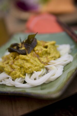 Thai food delicacies presented in traditional settingsの写真素材