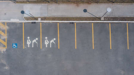 Exclusive parking space for pregnant women, with the paint on the lane in blue and white that symbolizes the person in this condition.の写真素材