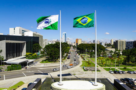 Flags of ParanÃ¡ (left side), state located in the southern region of Brazil - flag on the right side, and in the background on the left side the Legislative Assembly of ParanÃ¡ (Alep), seat of the state's legislative power, building located in Curitiba, capital of ParanÃ¡.の写真素材