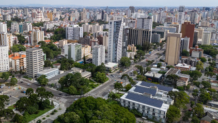 Drone view of the central region of Curitiba, capital of the state of ParanÃ¡, on a sunny day. Below on the right is the city hall of the capitalの写真素材