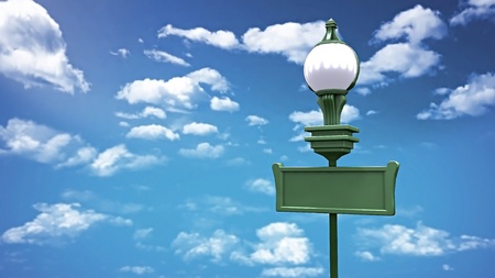 the blanked signage board and street lamp over the blue sky backgroundの写真素材