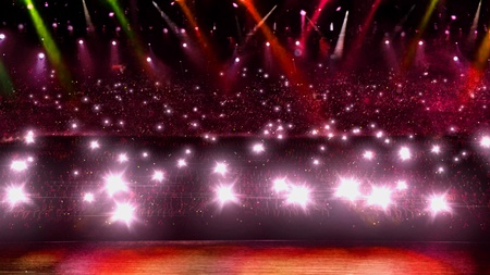 camera flash in concert with red spotlightの写真素材