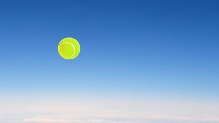 tennis ball high speed flying on the skyの写真素材
