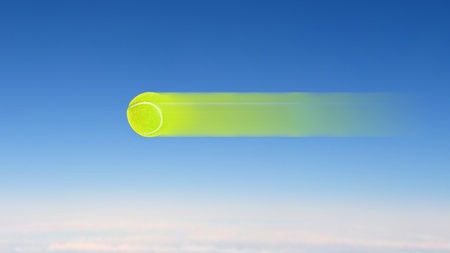 tennis ball high speed flying on the skyの写真素材