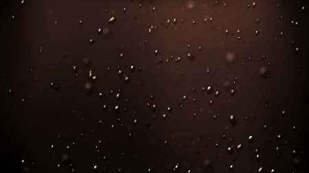 the bubbles floating up in the liquid of drink.の写真素材