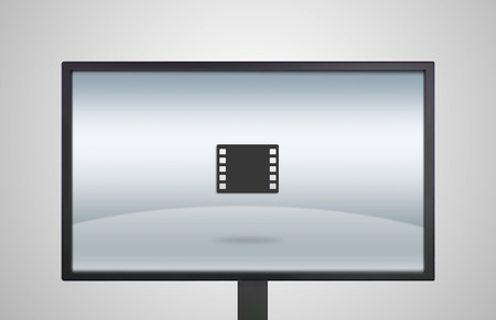 movie icon is showing on the monitor display, it is representing the selection of entertainment applicationの写真素材
