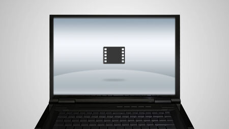 movie icon is showing on the monitor display, it is representing the selection of entertainment applicationの写真素材