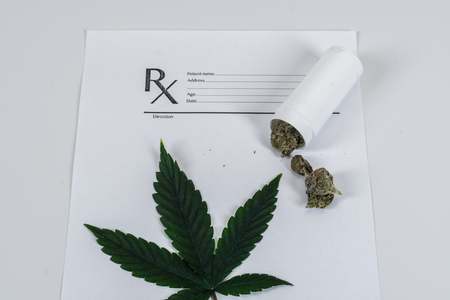 Medical Marijuana leaves Close Up Cannabis Buds with Doctors Prescription for Weed and pills on white backgroundの写真素材