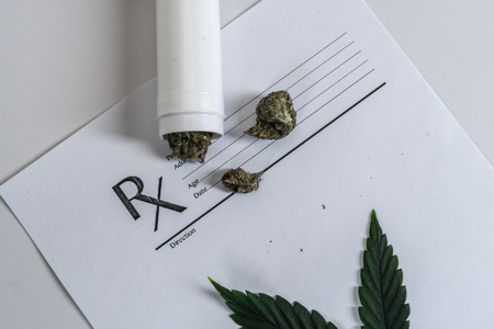 Medical Marijuana leaves Close Up Cannabis Buds with Doctors Prescription for Weed and pills on white backgroundの写真素材