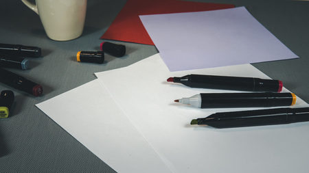 Open Colored Felt Tip Pens lie on the open notebook. Stationery for schoolchild or studentの写真素材