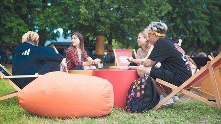 Kyiv, Ukraine - 07.09.2019: Atlas Weekend music festival outdoors, first day. Millennials are relaxin at music festival. People are dancing in the open sky.のeditorial素材