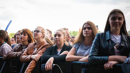 Kyiv, Ukraine - 07.09.2019: Atlas Weekend music festival outdoors, first day. Millennials are relaxin at music festival. People are dancing in the open sky.のeditorial素材