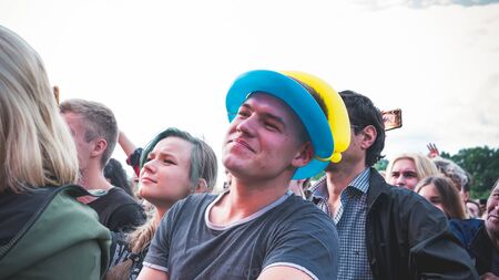 Kyiv, Ukraine - 07.09.2019: Atlas Weekend music festival outdoors, first day. Millennials are relaxin at music festival. People are dancing in the open sky.のeditorial素材