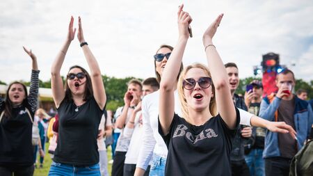 Kyiv, Ukraine - 07.09.2019: Atlas Weekend music festival outdoors, first day. Millennials are relaxin at music festival. People are dancing in the open sky.のeditorial素材