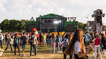 Kyiv, Ukraine - 07.09.2019: Atlas Weekend music festival outdoors, first day. Millennials are relaxin at music festival. People are dancing in the open sky.のeditorial素材