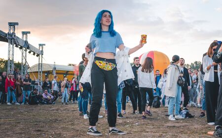 Kyiv, Ukraine - 07.13.2019: Atlas Weekend music festival outdoors, fifth day. Millennials are relaxin at music festival. People are dancing in the open sky.のeditorial素材