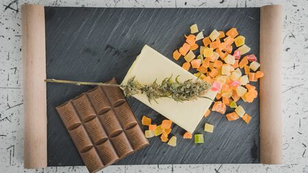 Preparing to cooking cake with cannabis butter. Concept of using marijuana in food industry. Cake...