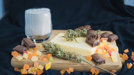 Preparing to cooking cake with cannabis butter. Concept of using marijuana in food industry. Cake...