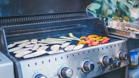 Sliced zucchini, grilled, picnic with barbecue in the open air. squash barbecue roasted on metal grill. Diet vegan bbq. Cooking vegetables on the grill outdoorsの写真素材