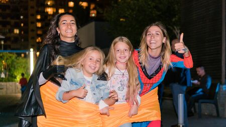 09/05/2019, Kyiv, Ukraine: Actors in suits of Spiderman and Batman working at the Birthday party for little children. Children play with animators, outdoorsのeditorial素材