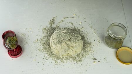 Preparing to cooking hemp cake or bread. Close-up of fresh dough with cannabis flour. Concept of uses marijuana in a food industryの写真素材