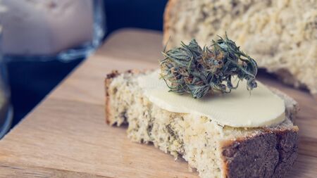 Close-up of bread with hemp flour, sandwich with cannabis butter and hashish. Concept of using...