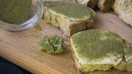 Close-up of bread with hemp flour, sandwich with cannabis butter and hashish. Concept of using marijuana in the food industryの写真素材