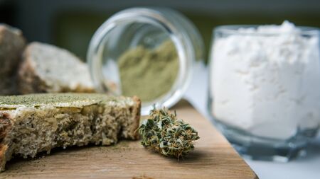 Close-up of bread with hemp flour, sandwich with cannabis butter and hashish. Concept of using marijuana in the food industryの写真素材