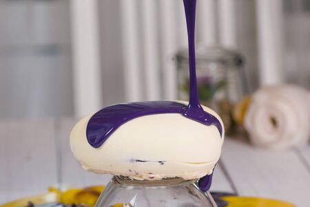 Step by step process of making mousse cake with mirror glaze. Cooking french dessert. Frozen mirror icing on the cake. Baking and confectionery concept.の写真素材