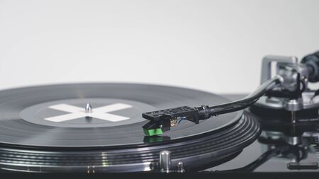 Close-up of modern turntable vinyl record player with music plate. Needle on a vinyl record. Concept of sound technology audio equipmentの写真素材