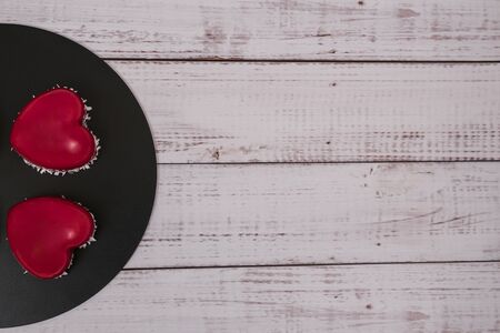 Close-up of mousse cake with red mirror glaze. Cooking french dessert. Frozen mirror icing on the cake. Baking and confectionery concept.の写真素材