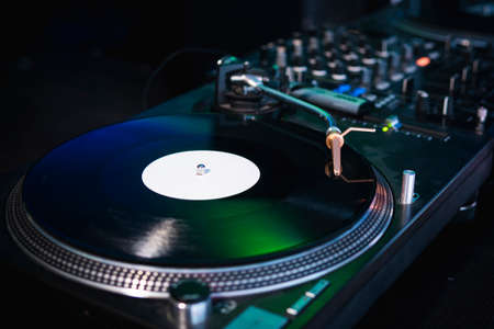 Close-up of modern turntable vinyl record player with music plate. Needle on a vinyl record. Concept of sound technology audio equipmentの写真素材