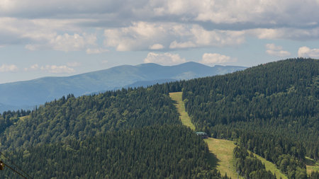 Amazing mountain landscape with blue sky with white clouds, sunny summer day in Carpathians, Ukraine. Natural outdoor travel background.の写真素材