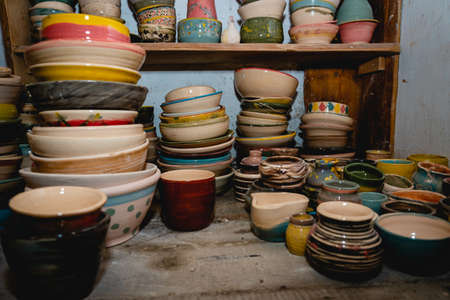 Hand made ceramic tableware, Collection of colorful clay pottery ceramics. Handicraft and art concept.の写真素材