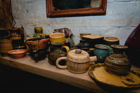 Hand made ceramic tableware, Collection of colorful clay pottery ceramics. Handicraft and art concept.の写真素材