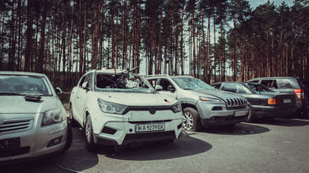 Irpin, Kyiv region, Ukraine - 28 April 2022: Car graveyard in Irpin, consequences of the invasion of the Russian army in Ukraine. Destroyed cars of civilian population.のeditorial素材