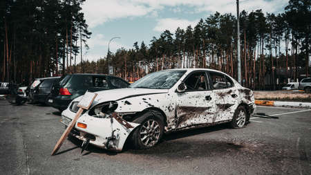 Irpin, Kyiv region, Ukraine - 28 April 2022: Car graveyard in Irpin, consequences of the invasion of the Russian army in Ukraine. Destroyed cars of civilian population.のeditorial素材