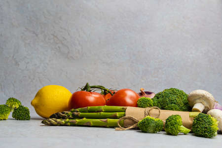Close-up of organic fresh green asparagus. Concept of healthy vegetarian food, diet and home cooking. copyspace.の写真素材