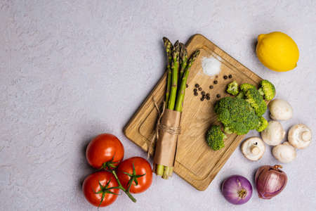 Close-up of organic fresh green asparagus. Concept of healthy vegetarian food, diet and home cooking. copyspace.の写真素材